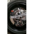 Motocorse Billet Aluminum Chain Adjuster and Rear Brake Caliper Support Bracket for OVERSUSPENSION for Ducati Panigale / Streetfighter V4 (2025+) Motocorse Billet Aluminum Chain Adjuster and Rear Brake Caliper Support Bracket for OVERSUSPENSION for Ducati Panigale / Streetfighter V4 (2025+)
